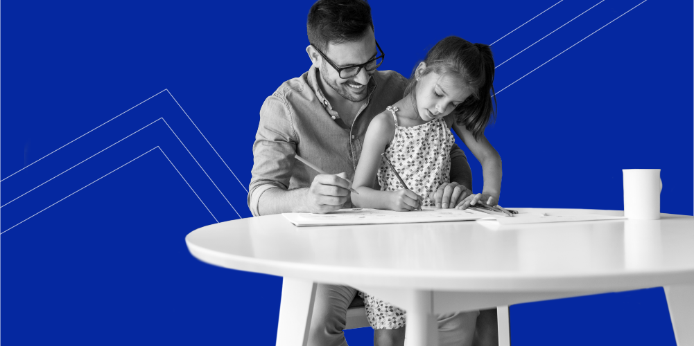 dad and daughter drawing at the table