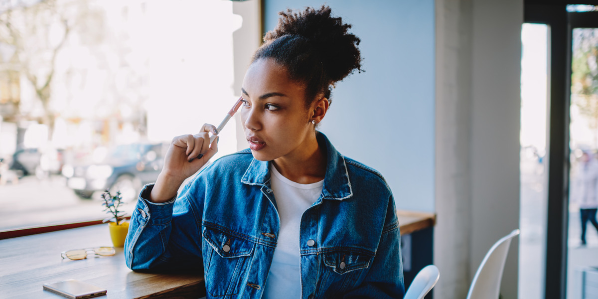 woman holding a pen